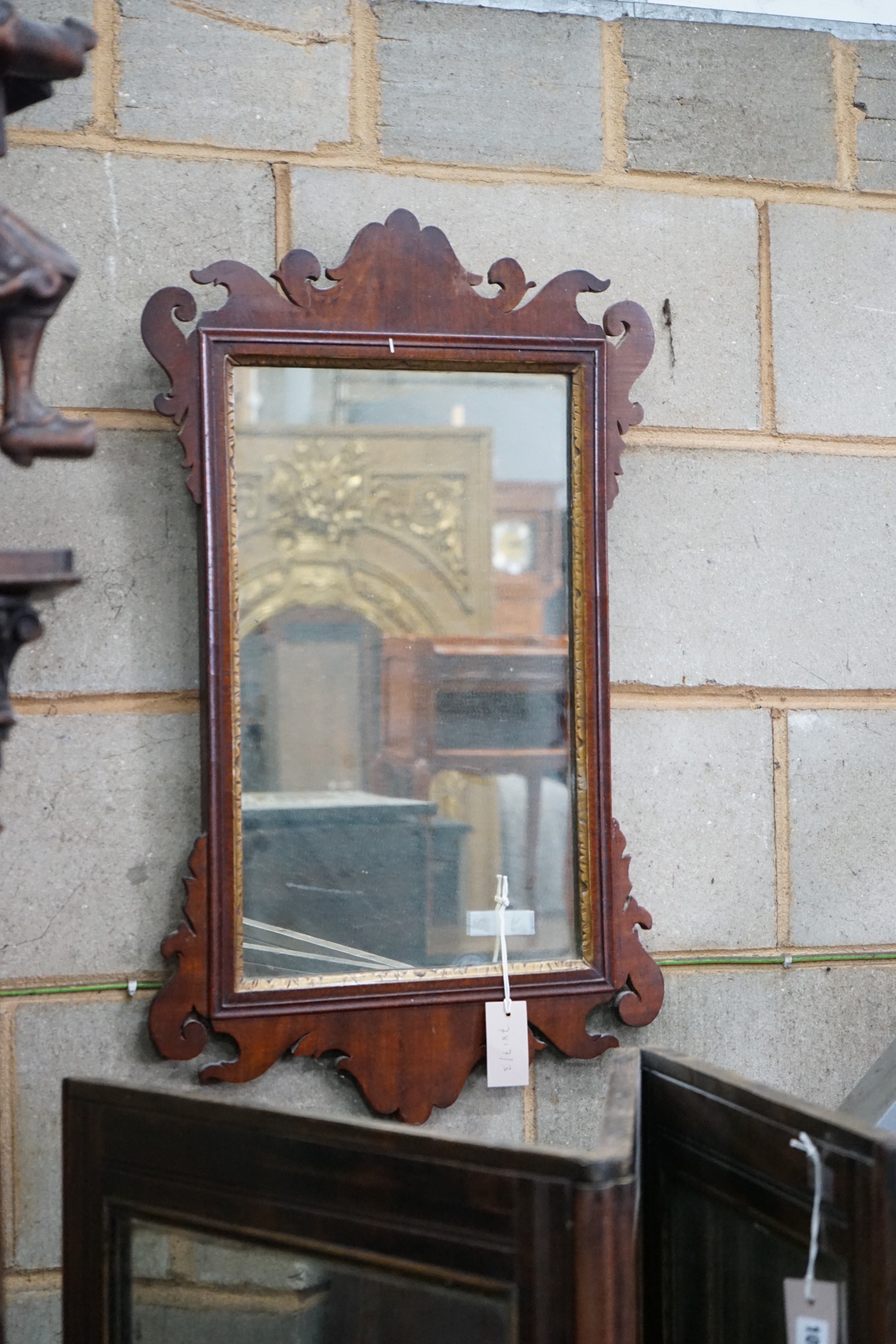 A George III style mahogany fret cut wall mirror width 45cms, height 75cms.